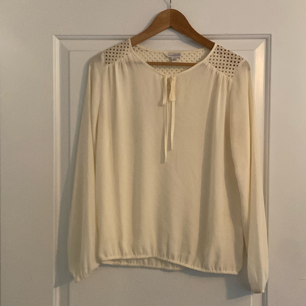 Charming Charlie off-white, tie-neck blouse.